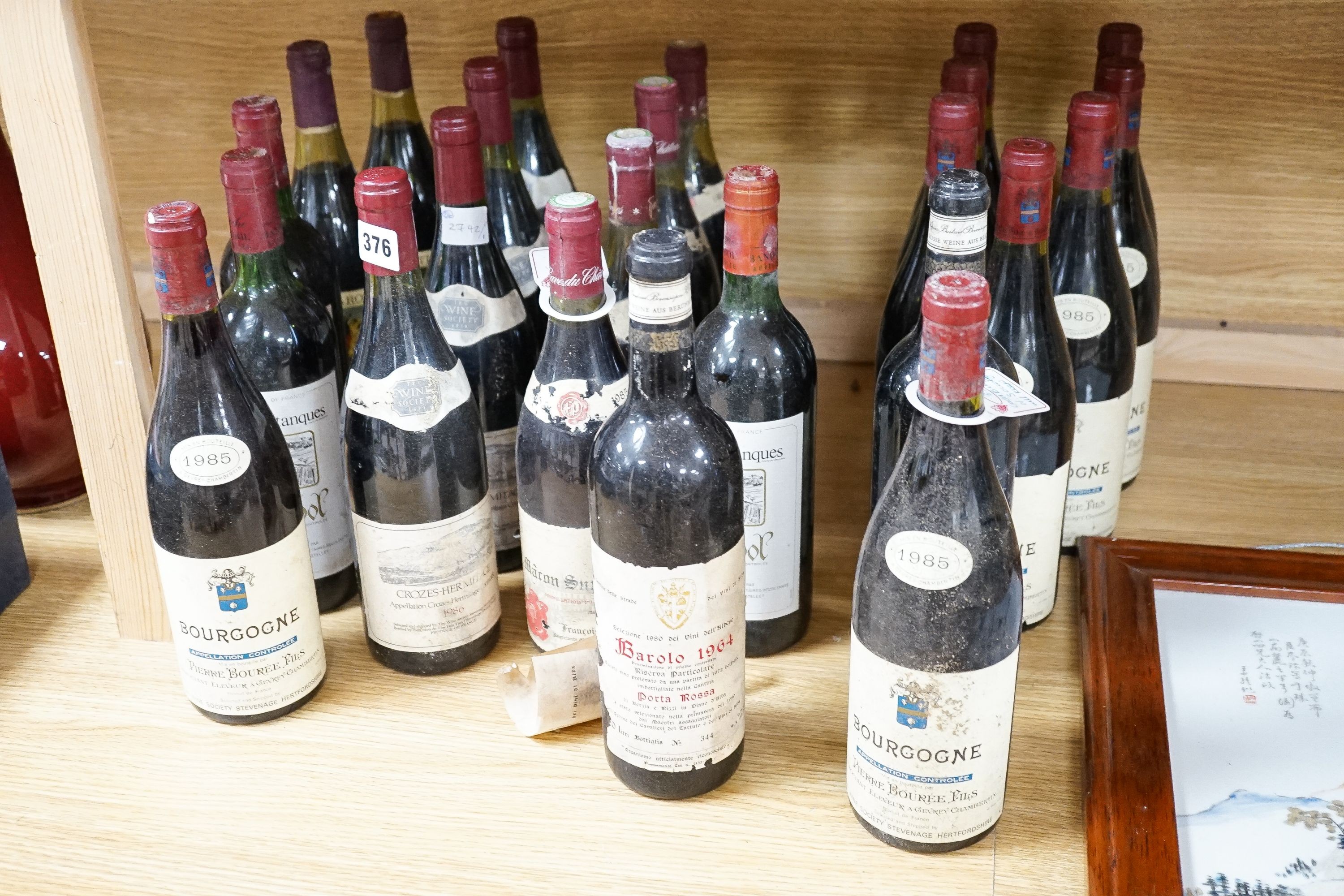 A collection of 24 bottles of red wines including 9 bottles of 1985 Bourgogne, 2 bottles of 1964 Barolo, 4 bottles 1986 Crozes Hermitage